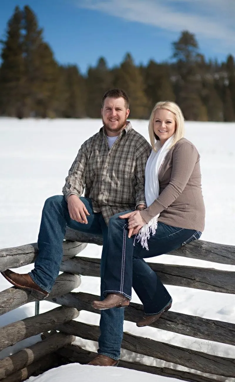 Zach and Jayne Hascall, owners of HSR Cabin Services, out in the snow